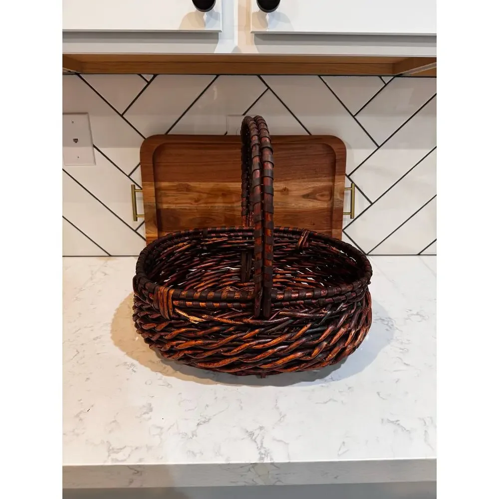 dark stained willow basket rustic handwoven texture sturdy center handle vintage